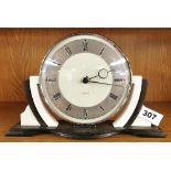 An Art Deco Bakelite mantle clock, W. 26cm. Understood to be in working order.