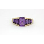 A 9ct yellow gold amethyst set ring, (M.5).