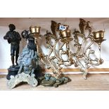 A pair of spelter figurines, four antique brass drawer handles, a brass lions head door knocker