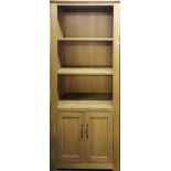 A contemporary solid oak bookcase with cabinet below, 90 x 191cm.
