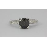 A Tresor, Paris fancy black diamond solitaire ring (1.75ct centre) with white diamond set