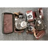 Two vintage Russian movie cameras and two still cameras.
