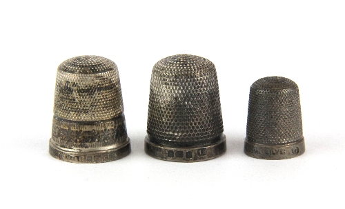 Two Hallmarked silver thimbles and one marked Sterling Silver.