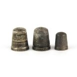 Two Hallmarked silver thimbles and one marked Sterling Silver.
