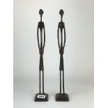 A pair of African style tribal bronze figures, H. 43cm.