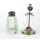 A hallmarked silver hatpin holder set with an amethyst thistle, H. 11cm, together with a