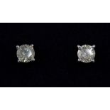 A pair of 18ct white gold diamond solitaire earrings, approx 0.78ct total