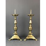 A pair of 18th/19th Century Continental brass prickett candlesticks, H. 40cm.