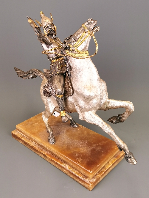 A silvered and gilt heavy metal figure of a Viking riding a horse (figure detachable) set on a brown - Image 2 of 5