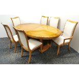 An impressive high quality Stanley Furniture oval extending dining table and six chairs, extending