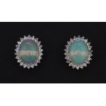 A pair of 925 silver cabochon cut opal and white stone set stud earrings, L. 1.2cm.