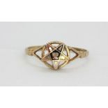 Masonic Interest. A 9ct yellow gold ring set with an enamelled star insignia, (N).