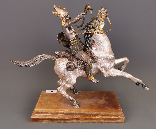 A silvered and gilt heavy metal figure of a Viking riding a horse (figure detachable) set on a brown - Image 4 of 5
