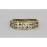 A 9ct yellow gold stone set crossover ring, (O.5).