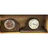 Two oak veneered mantle clocks, H. 23cm. Understood to be in working order.