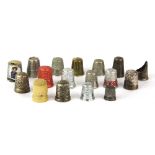 A collection of mixed thimbles including Sterling Silver and ivory.
