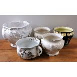 A Victorian Doulton chamber pot and four ceramic plant holders.