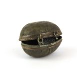 A Victorian egg shaped thimble holder containing a Birmingham Hallmarked silver thimble, egg