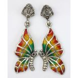 A pair of 925 silver and marcasite enamelled butterfly shaped earrings with ruby set eyes, L. 4cm.