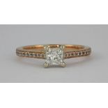A pretty 18ct (stamped 750) rose and white gold princess cut diamond solitaire (approx 0.5ct) ring