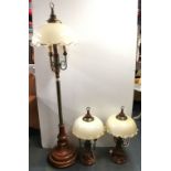An impressive hardwood and brass Dutch standard lamp, H. 178cm, with a pair of matching table