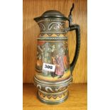 A large German hand painted pewter and stoneware Mettlach stein.