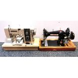 Two vintage sewing machines.