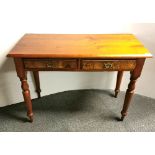 An attractive pine desk with burr walnut veneered drawer fronts, W. 107cm, H. 78cm.