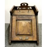 An Art Nouveau mahogany and brass coal box.