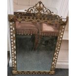 A vintage brass mirror, W. 60cm, H. 97cm.