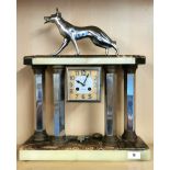 A large Desoleil Le Portel Art Deco marble and chromed mantle clock mounted with a dog , H. 48cm.