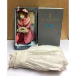 A Royal Doulton doll and a antique christening robe.