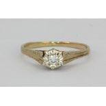 A 9ct yellow gold diamond set solitaire ring, (M).