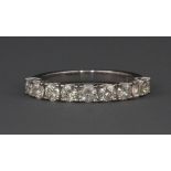 An 18ct white gold half eternity ring (stamped 750) set with over 1ct of diamonds (N)