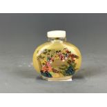 A 1960's Chinese inside painted snuff bottle of court ladies in a garden with extensive