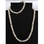 A 925 silver pearl necklace and matching bracelet.