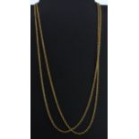 Two yellow metal (tested 9ct gold) chains, L. 60cm.