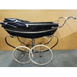 A full size vintage Silver Cross baby's pram.