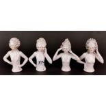 A group of four porcelain half dolls, H. 12cm.