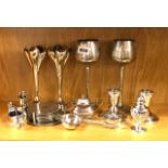 A pair of sterling silver candlesticks with a quantity of silver plated items.