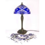 An Art Nouveau style cut glass table lamp with glass bead fringe currently detached, H. 54cm.