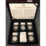 A boxed set of Morgan Mint Mark dollar coins.