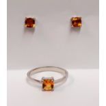 A marching pair of 925 silver stud earrings and ring set with cushion cut citrine, (P).