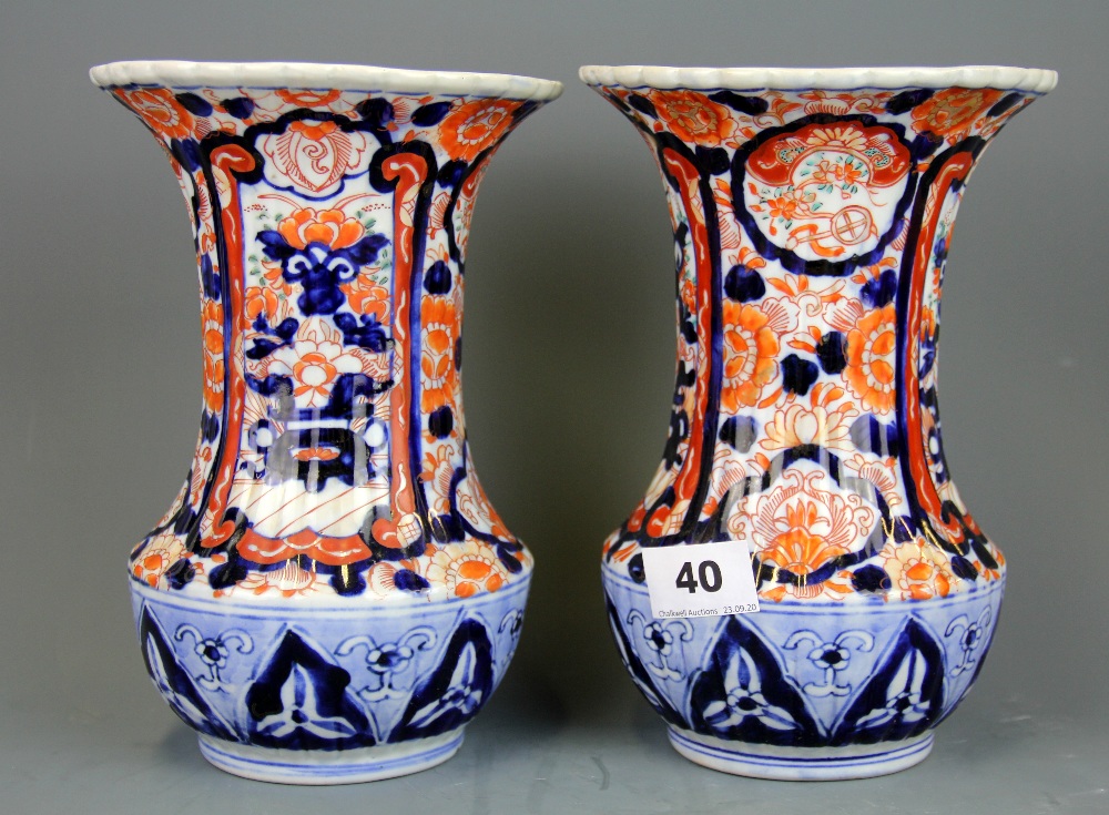 A pair of 19th Century Japanese Imari vases, H. 21cm.