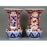 A pair of 19th Century Japanese Imari vases, H. 21cm.