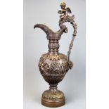 A large 19th Century bronze urn decorated with putti, H. 57cm.