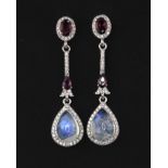 A pair of 925 silver drop earrings set with pear cabochon cut moonstone, rodolite garnets and