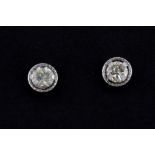 A pair of 9ct white gold diamond set stud earrings.