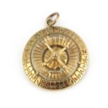 A 9ct yellow gold roulette shaped pendant, L. 3.5cm.