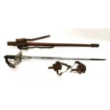 A Cavalry officers sword with leather sheath and King George V pierced monogram with a pair of